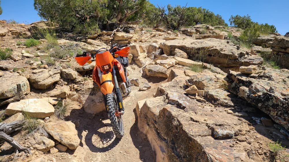motorcycle wedged between rocks
