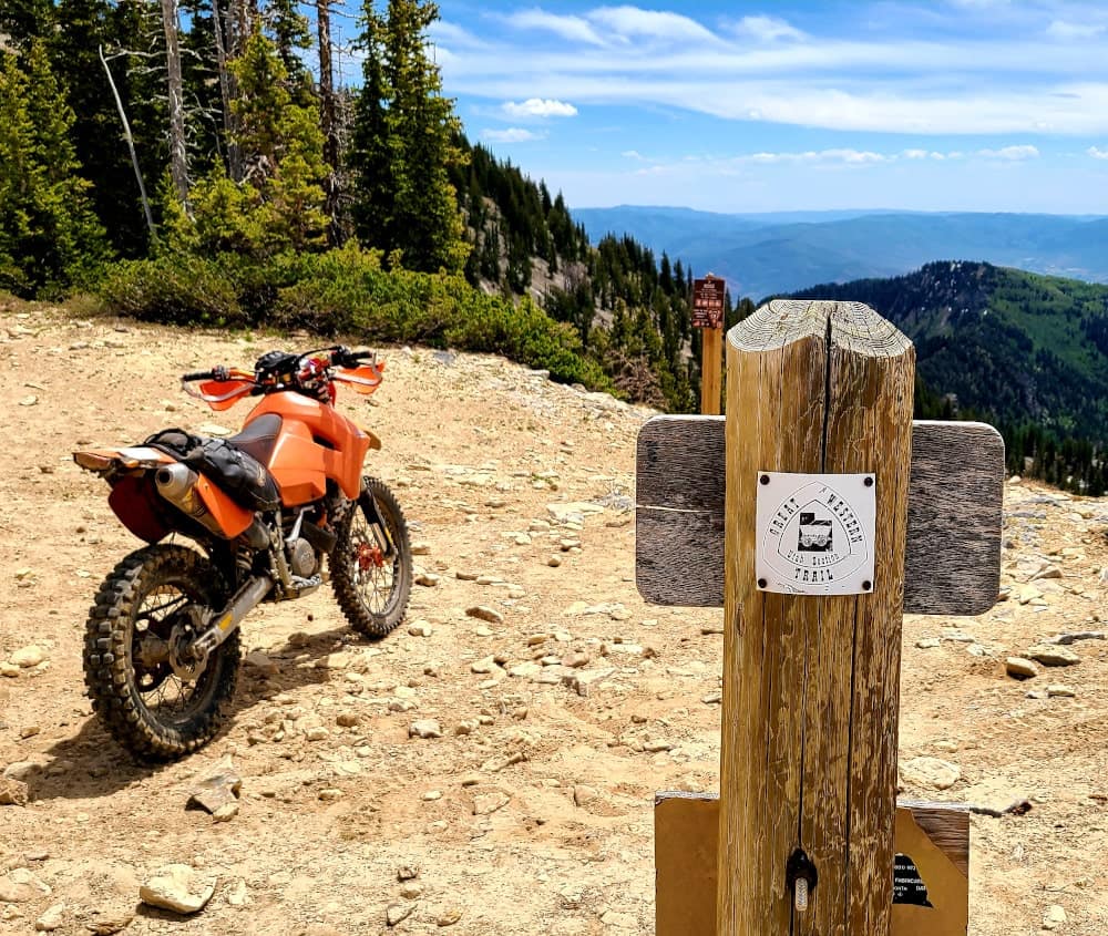 motorcycle parked atop a mountain pass