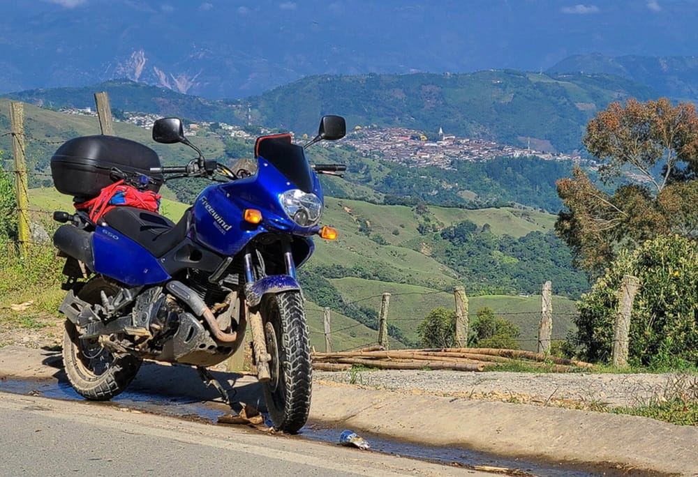 motorcycle and a town in the distance