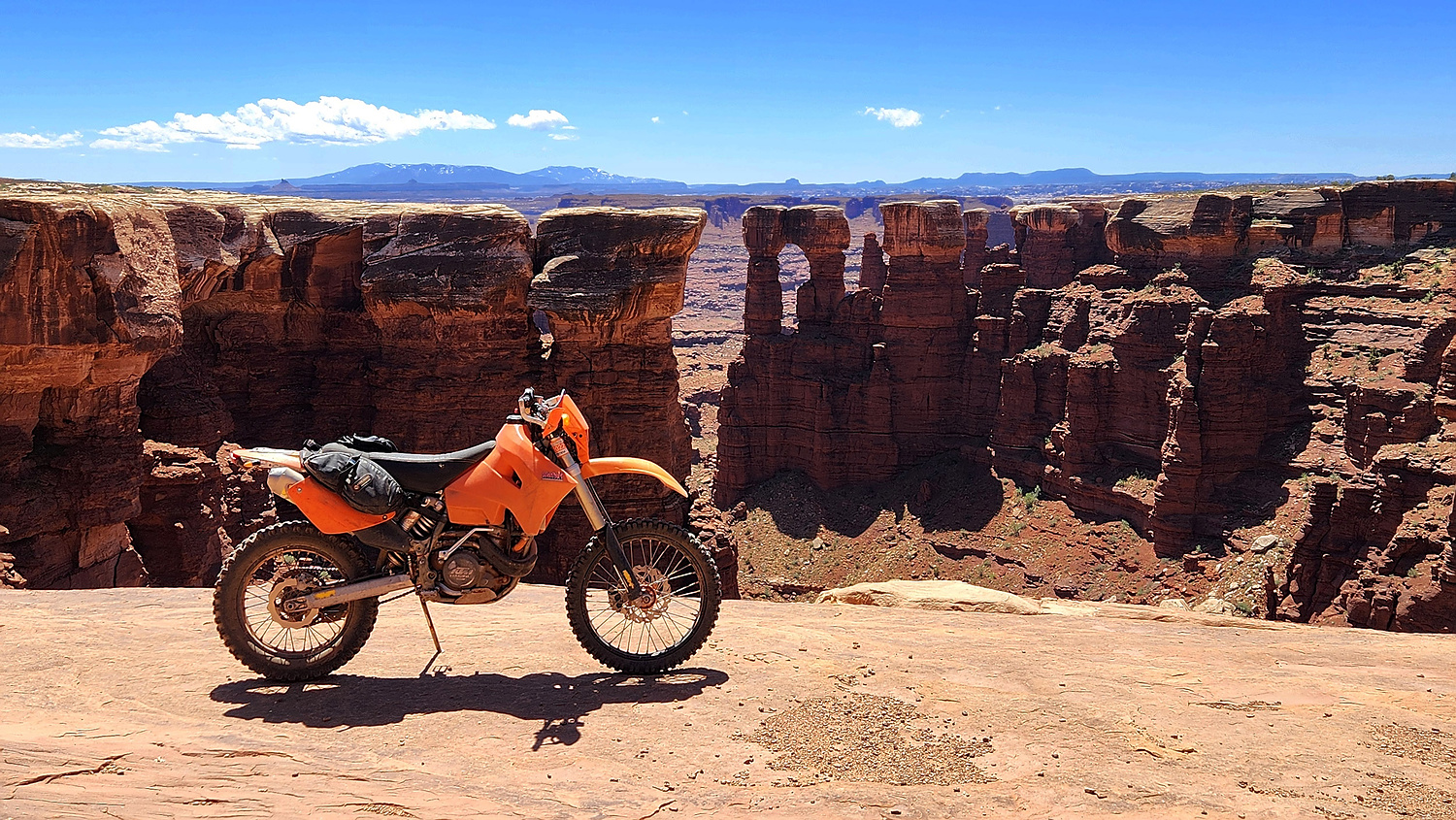 motorcycle parked at the edge of a canyon