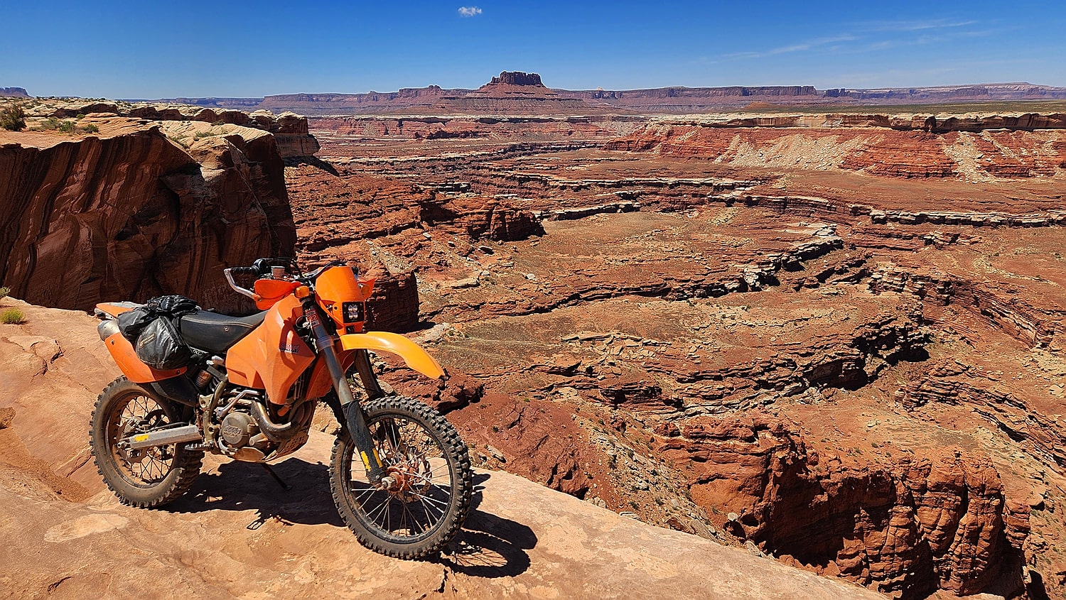 motorcycle parked at the edge of a canyon