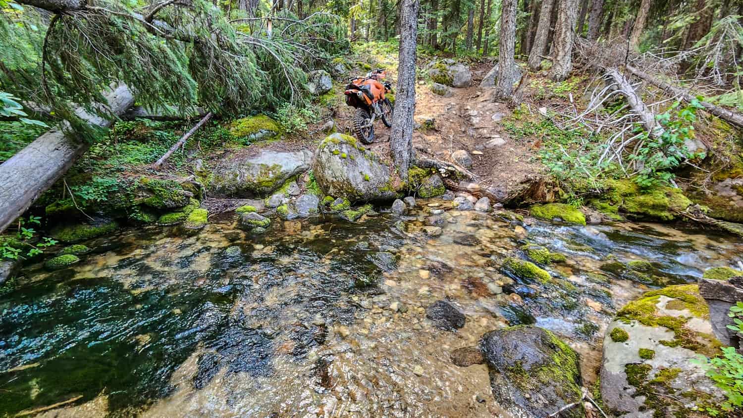 motorcycle near a creek