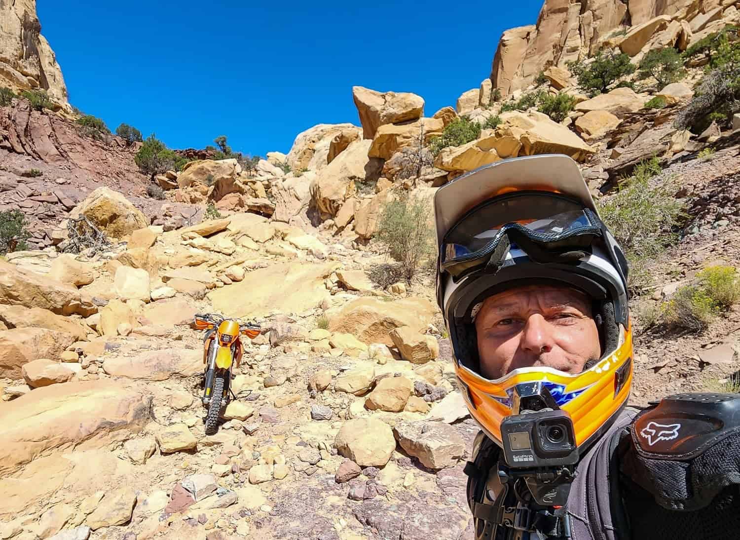 selfie of a rider at the bottom of a rocky trail