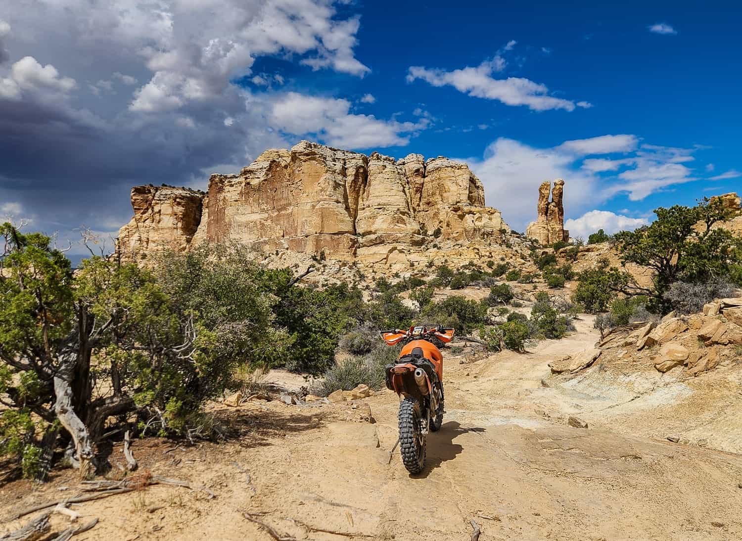 motorcycle in front of strange rock formations