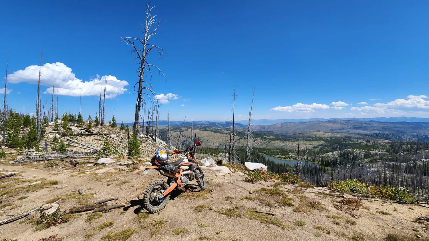 motorcycle parked atop a mountain ridge
