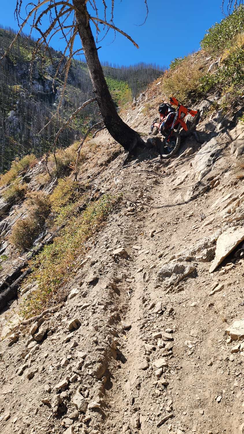 motorcycle on a narrow, steep and exposed trail
