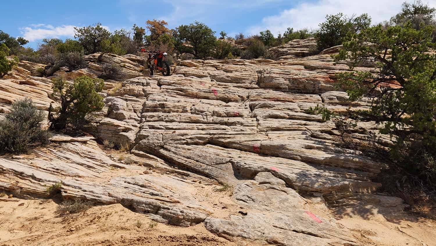 motorcycle parked atop rock steps