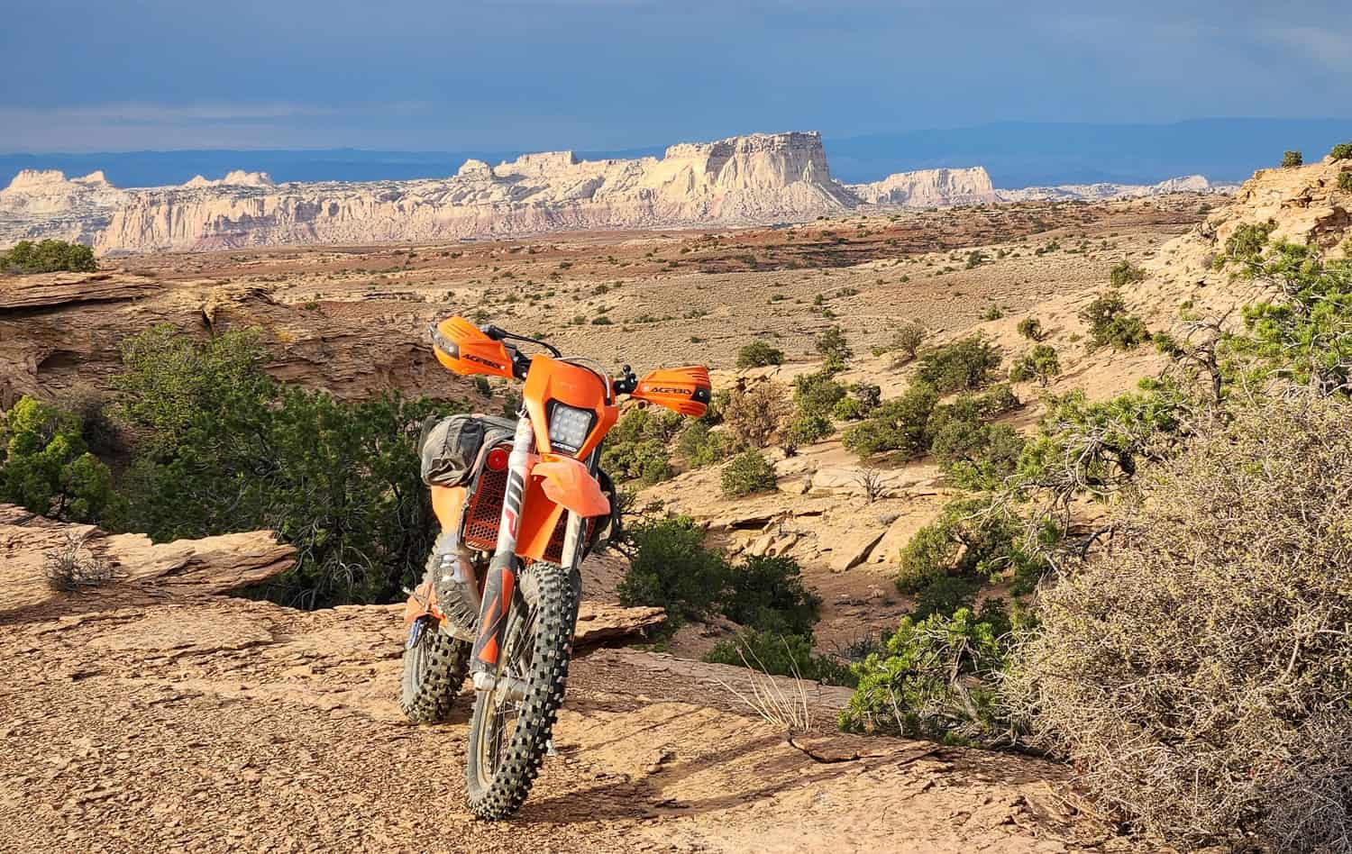 motorcycle with mountain cliffs in the distance