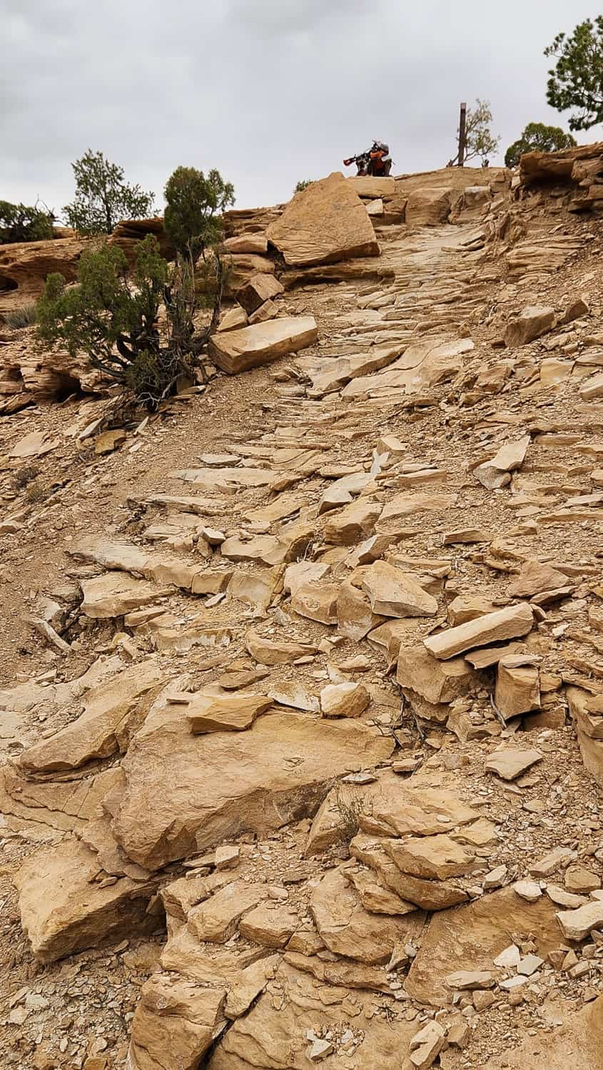motorcycle parked atop rock steps