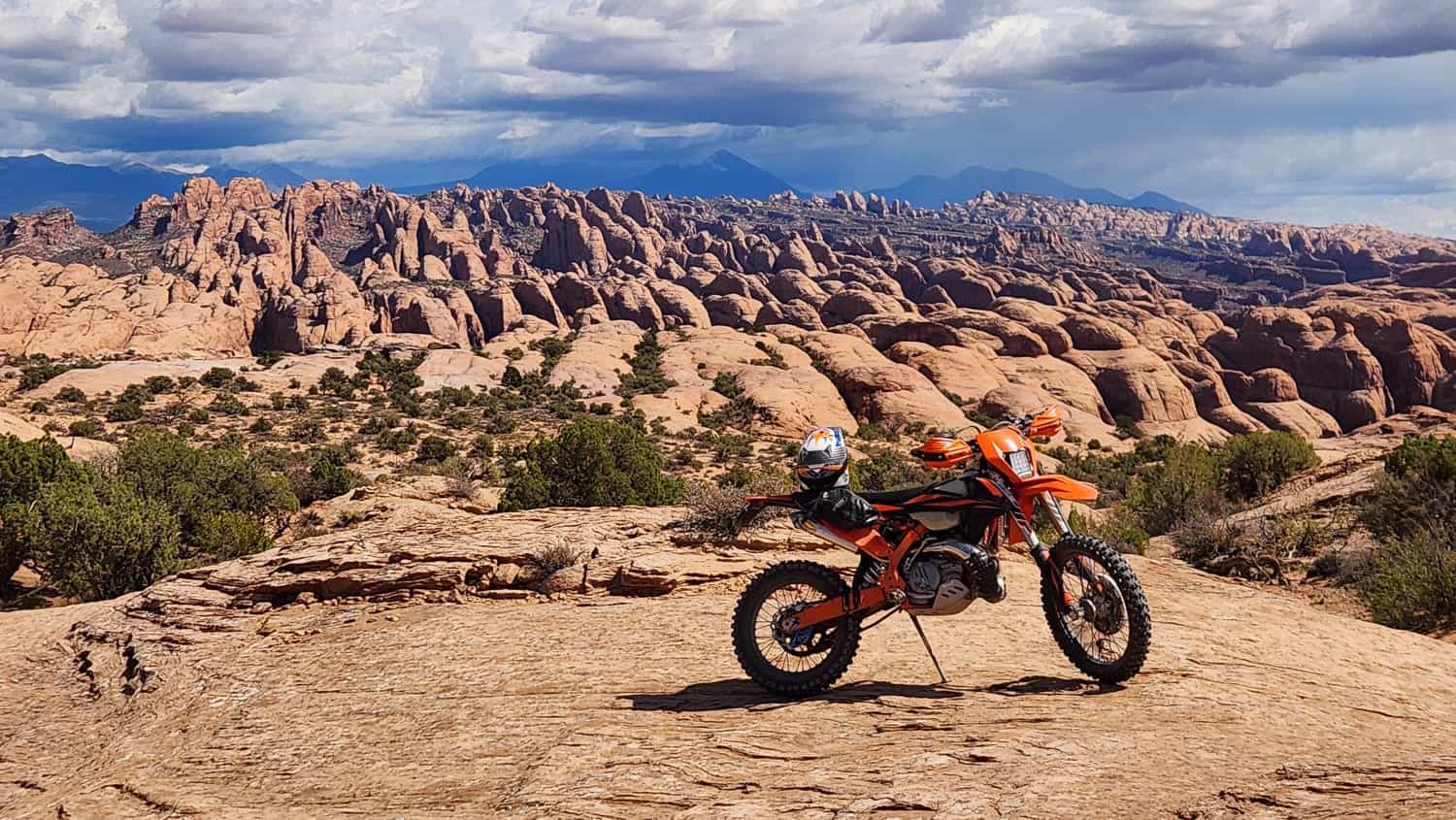 motorcycle with strange rock formations behind