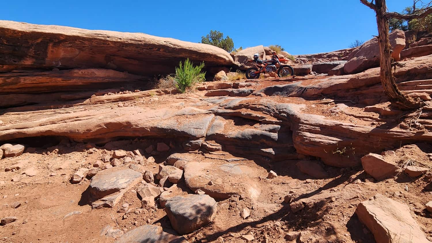 motorcycle parked atop rock steps