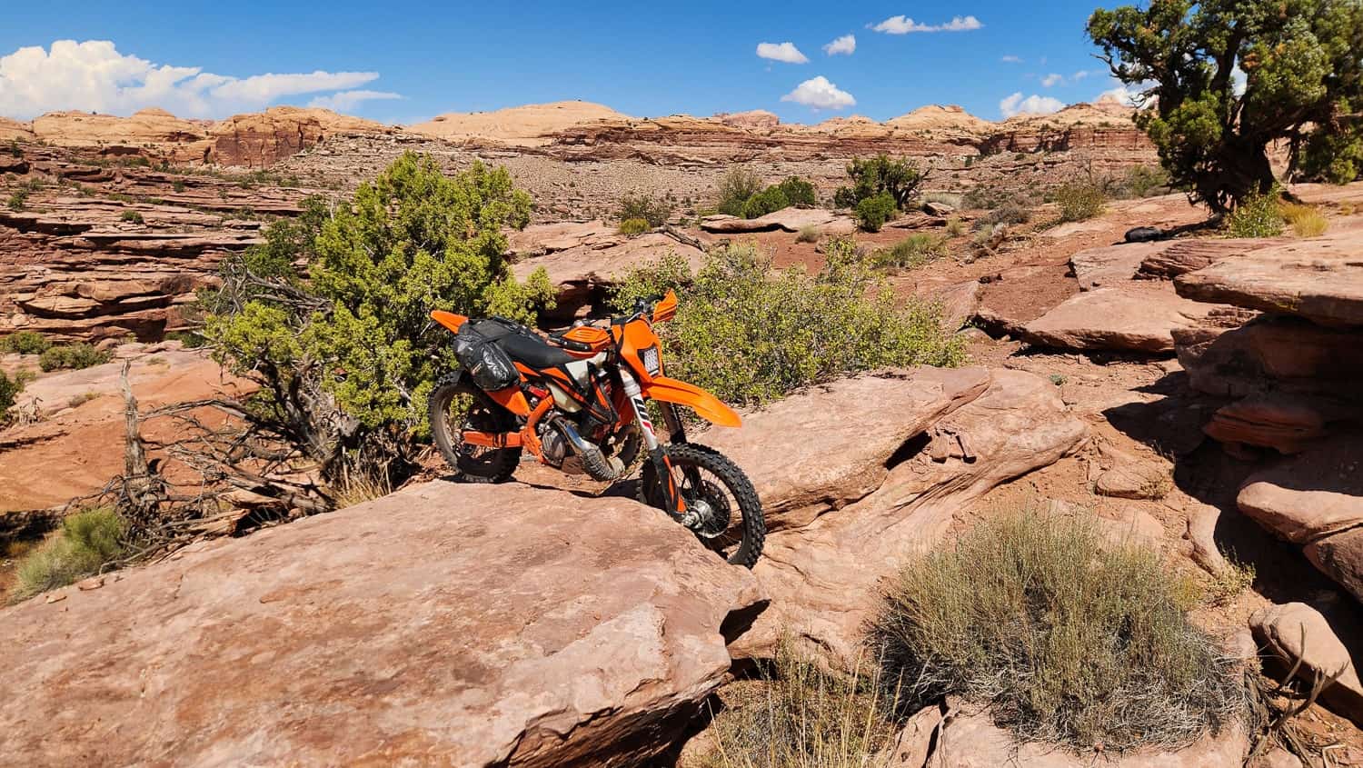 motorcycle wedged between two big boulders