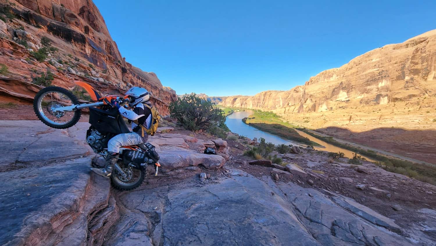 rider on a motorcycle climbing up rock steps