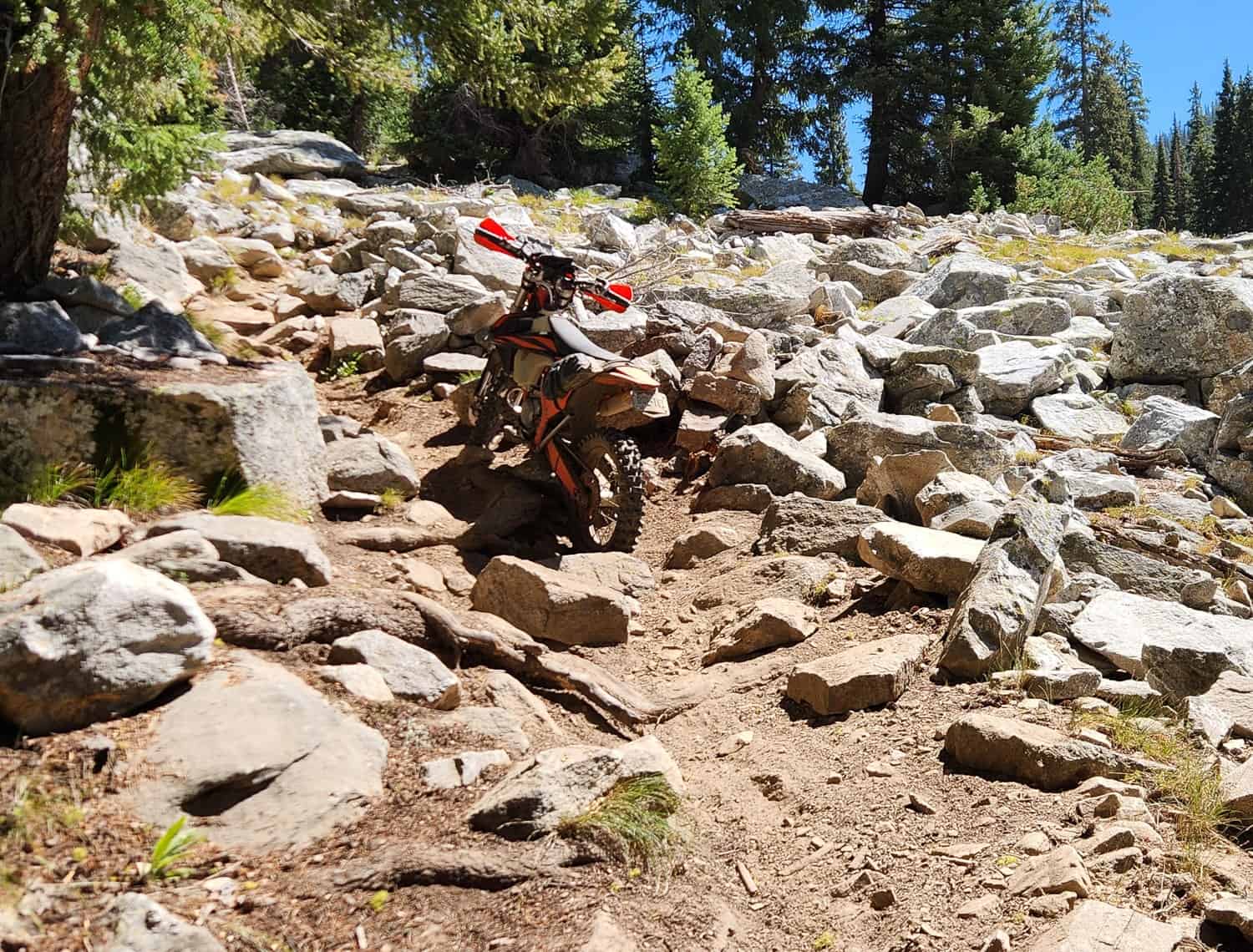 motorcycle surrounded by large rocks