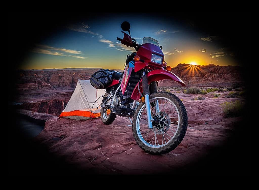 motorcycle and tent at sunset