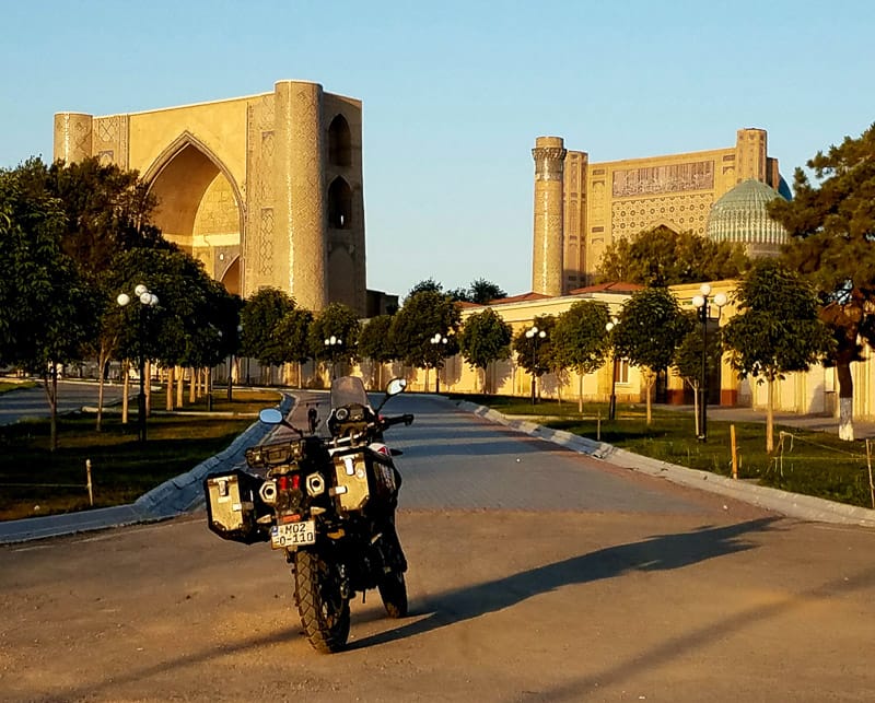motorcycle parked in front of a mosque complex