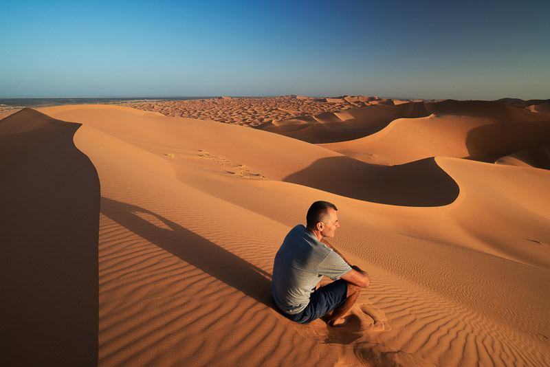 sitting atop a san dune