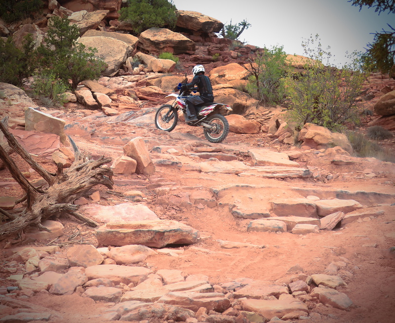 rider going up rocky trail