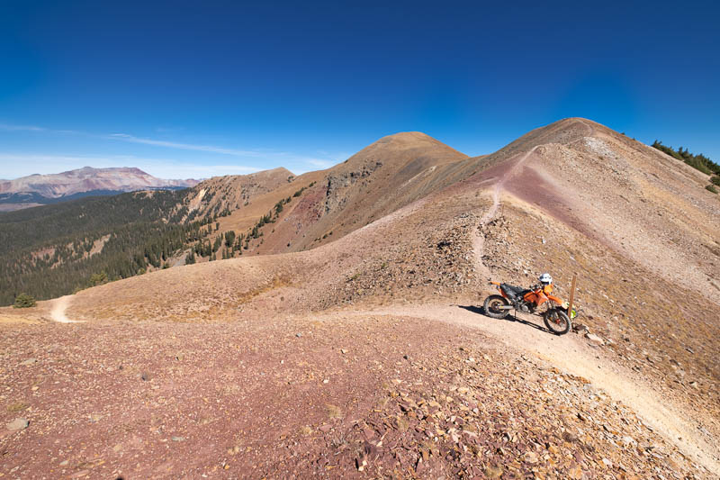 motorcycle parked on a top of a pass