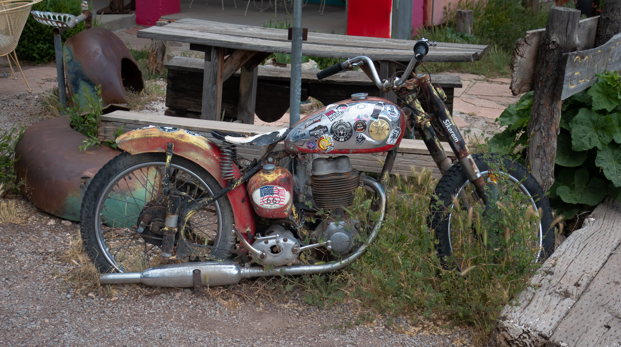 old motrocycle with various stickers on it 